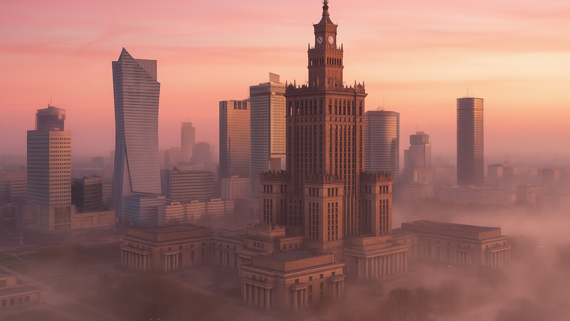 Skyline von Warschau in Polen bei Morgenröte mit dem Kulturpalast und modernen Wolkenkratzern.